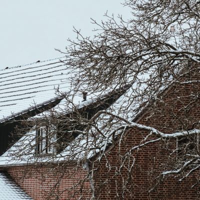 Roof of a house covered by snow in winter.