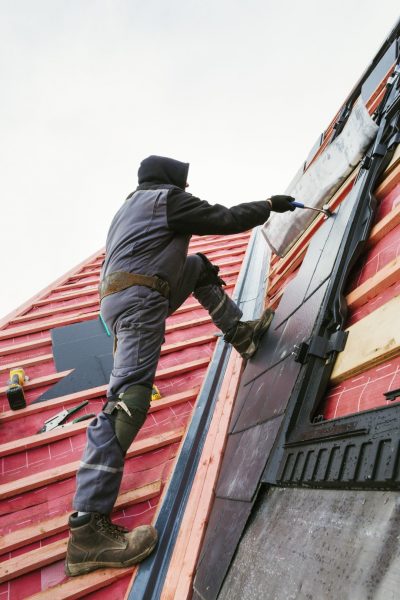 Tiles being installed for roof replacement by Southern Guard Roofing.